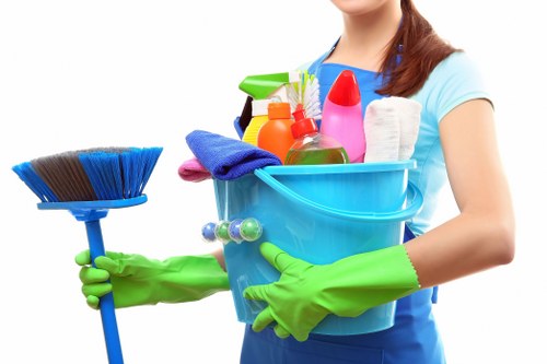 Carpet cleaning technician preparing equipment for a booked service